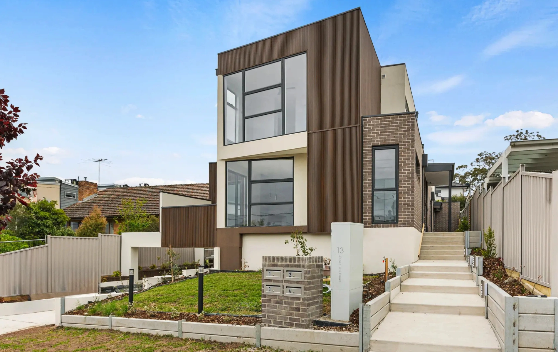 Aerial view of a modern luxury house with landscaped garden