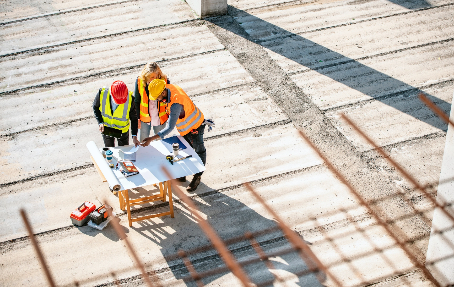 Construction site project team reviewing plans