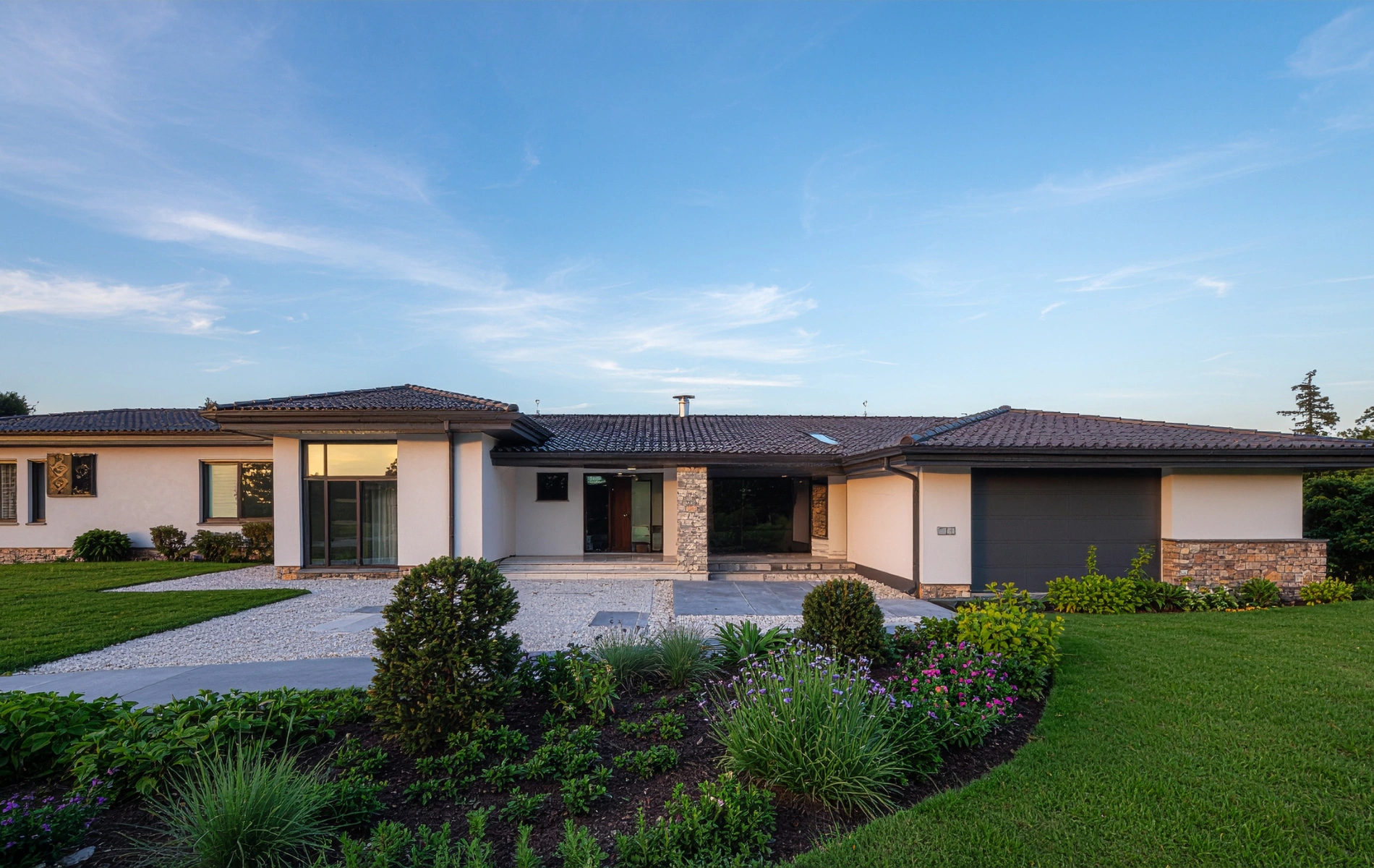 Front exterior of a modern ranch style home